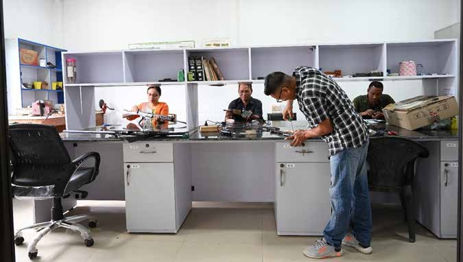 Renovated Ballistic Laboratory working table with mounted racks and cabinets